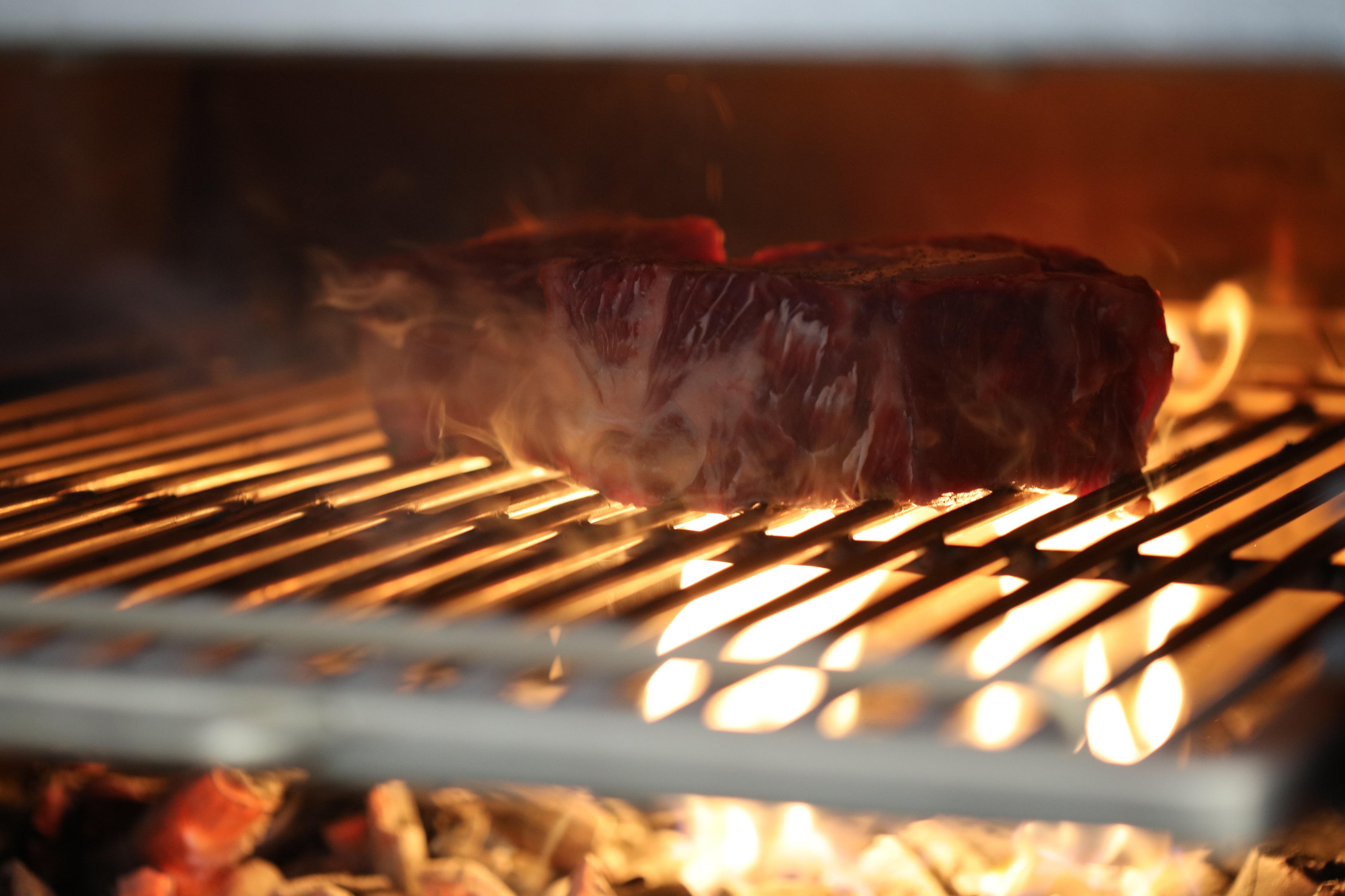 Bo Hotel Palma Exterior photo A steak being cooked on a barbecue.