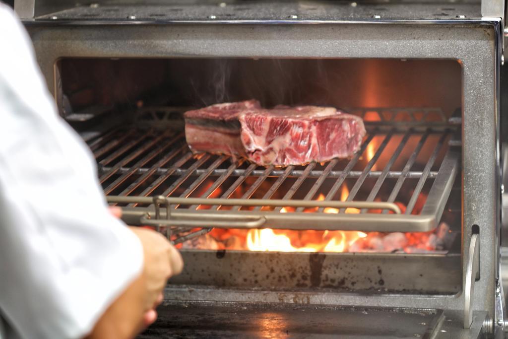 Bo Hotel Palma Exterior photo A steak being cooked on a barbecue